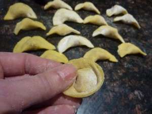 Pinching corners to form tortellini