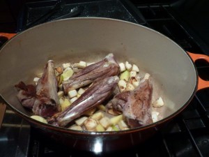 Lamb shanks on top of browned vegetables - recipes from Italiaoutdoorsfoodandwine