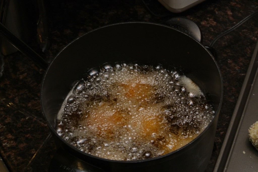 Frying arancini - Italiaoutdoorsfoodandwine bike tours italy ski