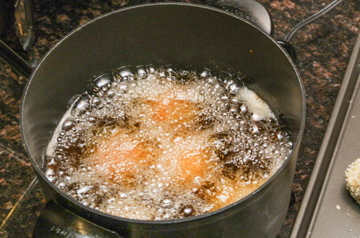 arancini-frying-sicily-italiaoutdoors-private-italy-tours